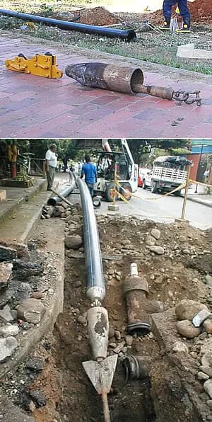 Cabezal de pipe bursting y tubería PEAD nueva entrando por el pozo de trabajo